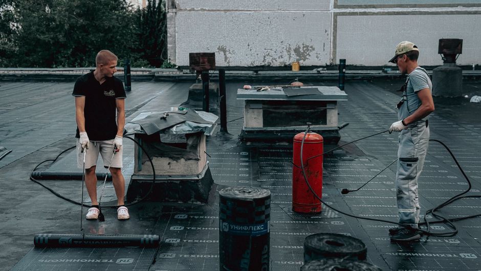 A professional roofing crew working on a residential roof